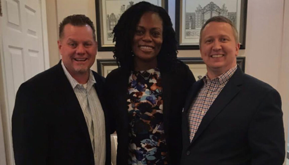 Realtor Richard Beeman and Rich Torrence with home owner Ngozi Kalamu