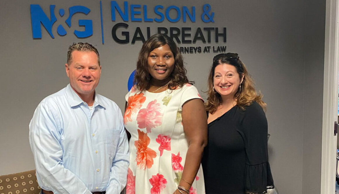 Chief Operating Officer Trish Beeman and Realtor Richard Beeman with home owner Lorna Telfer