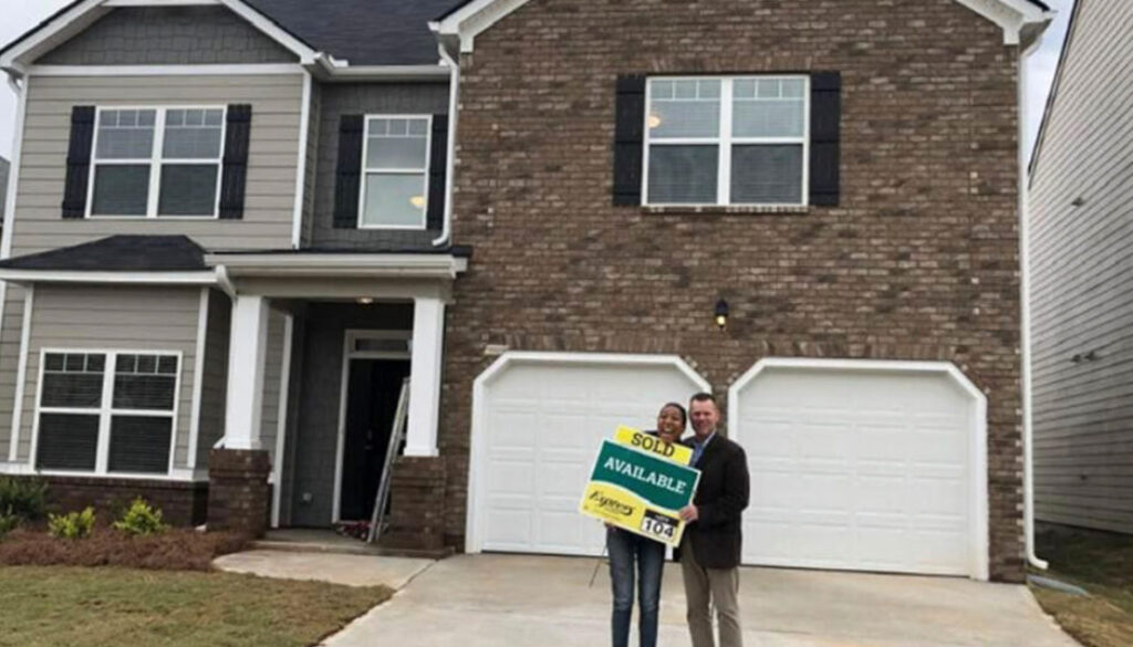 Realtor Richard Beeman with home owner Leah Conley