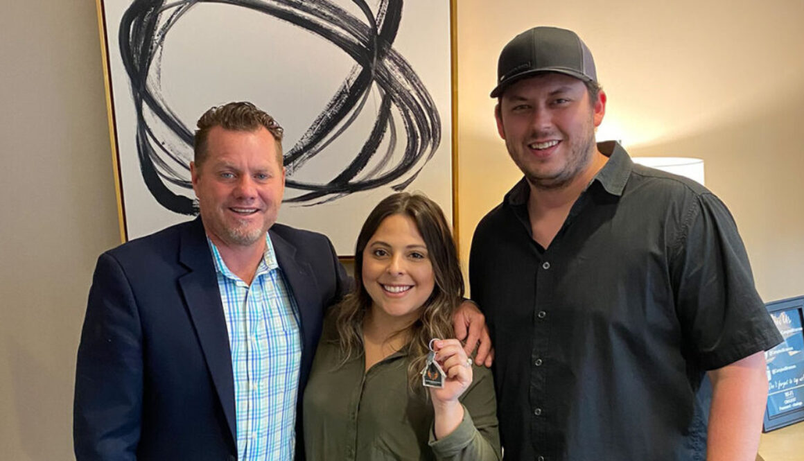 Realtor Richard Beeman with home owners Cat Gutierrez and John Taylor Russell