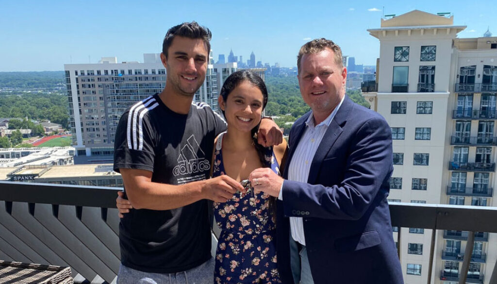 Realtor Richard Beeman with home owners Steve Covino and Lara Silva with keys