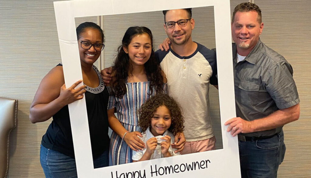 Realtor Richard Beeman with home owners Rob and Dee Sultan with their two children